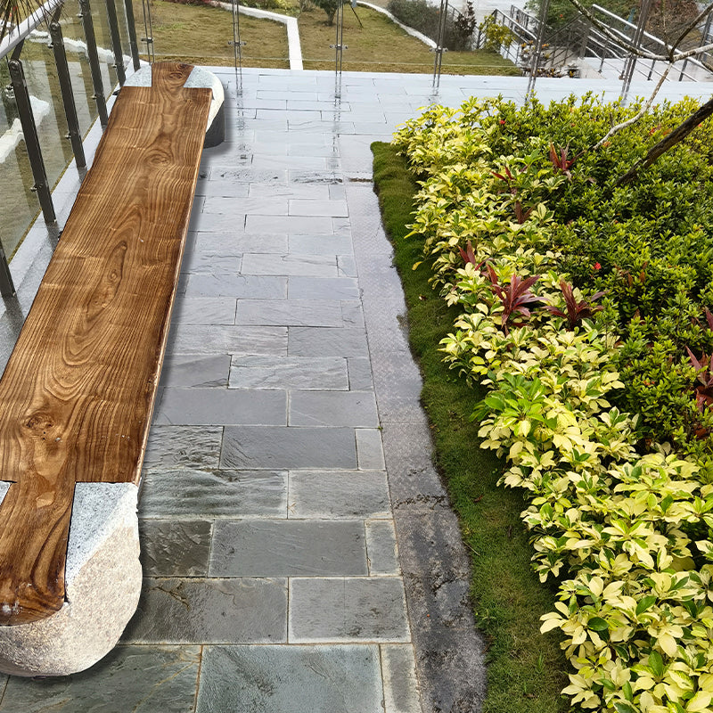 Long bench combining stone and wood